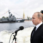 Russian President Vladimir Putin inspects warships on the Neva river during the Navy Day parade in St. Petersburg